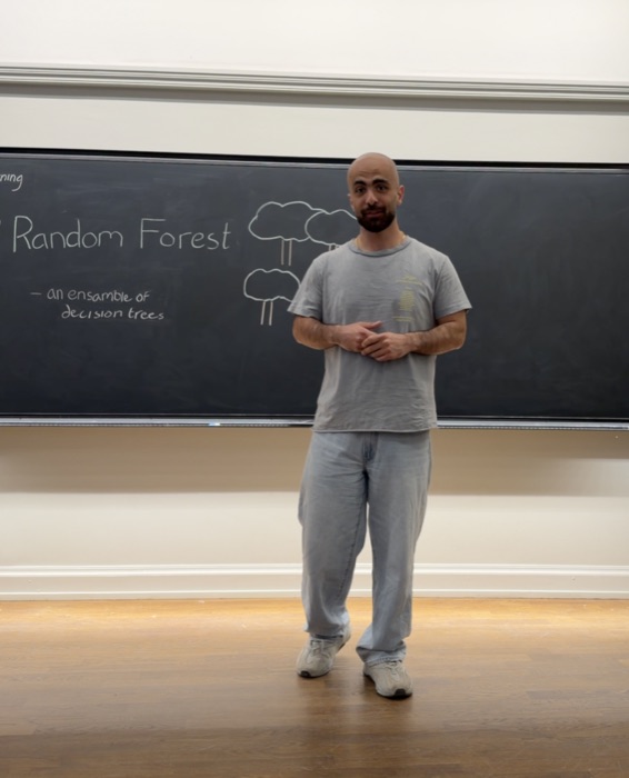 Majd Jamal explaining random forests at a blackboard